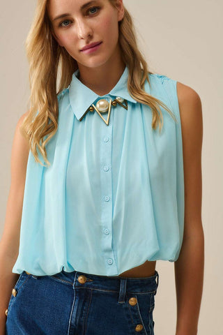 baby blue chiffon blouse with pleats at the hem