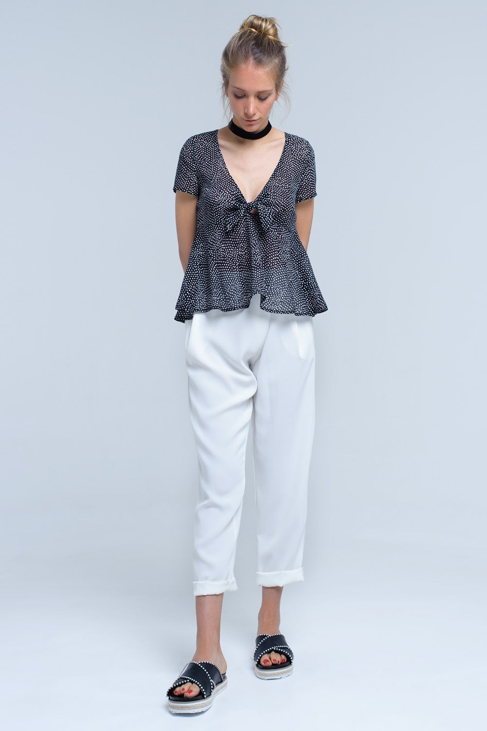 Black polka dot top with ruffle hem - Tops