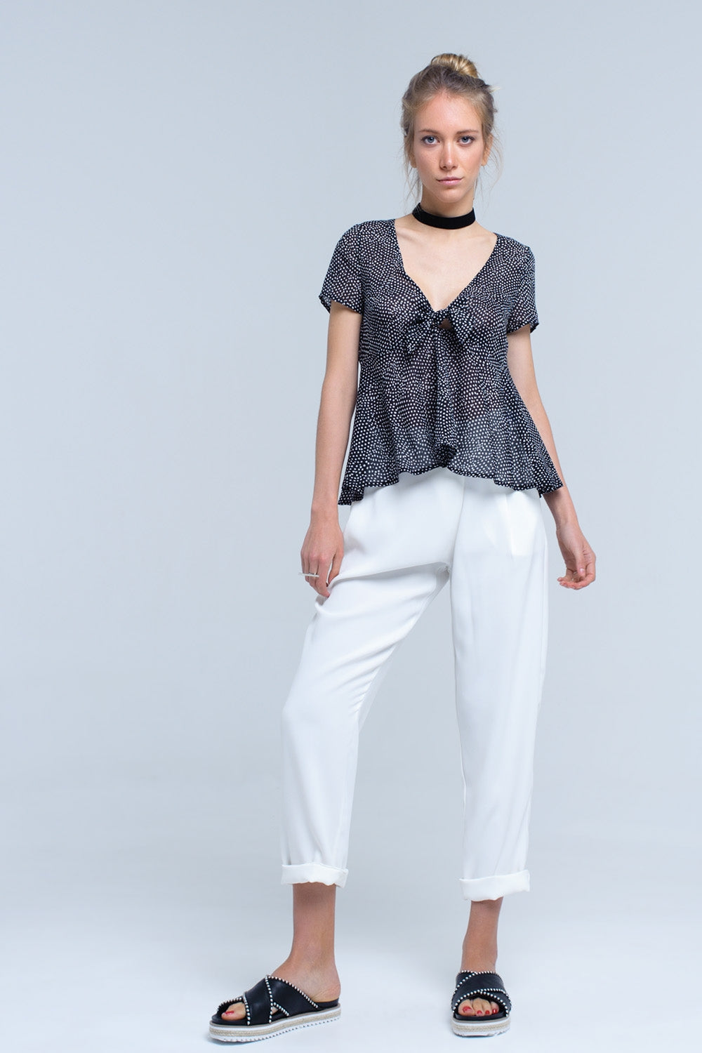 Black polka dot top with ruffle hem - Tops