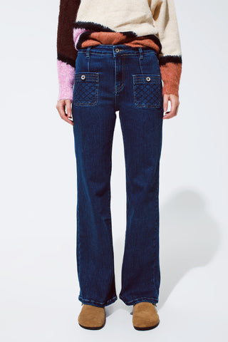 Blue jeans with buttoned pocket details in dark wash
