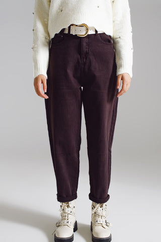 Brown relaxed pants with pocket detail at the waist