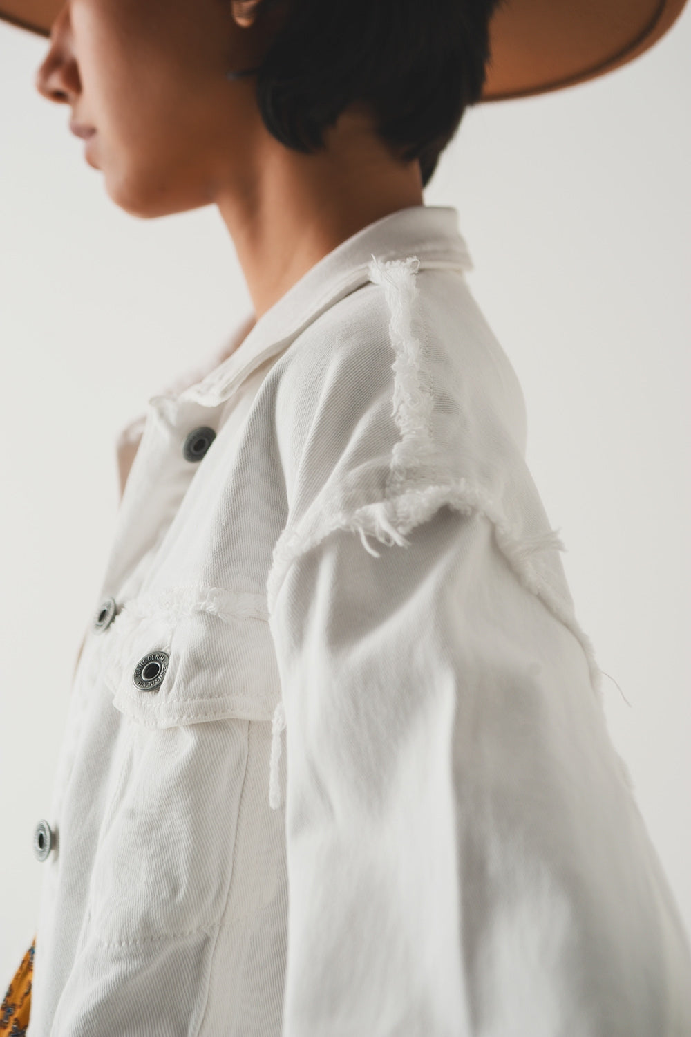 Cropped denim trucker jacket in white - Jackets