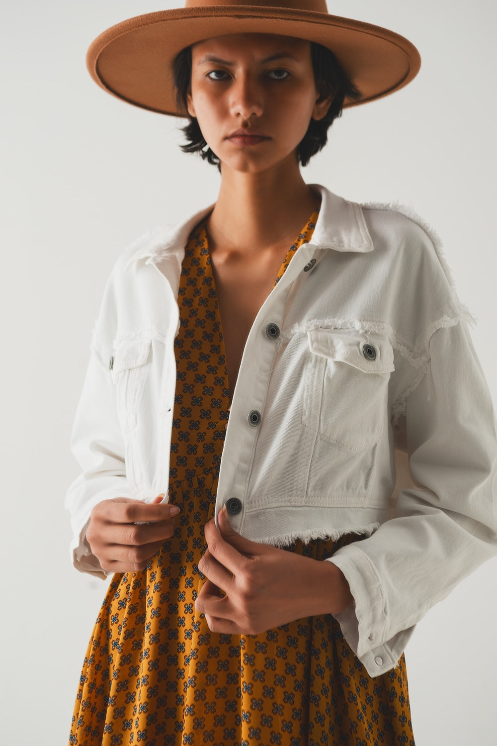Cropped denim trucker jacket in white - Jackets