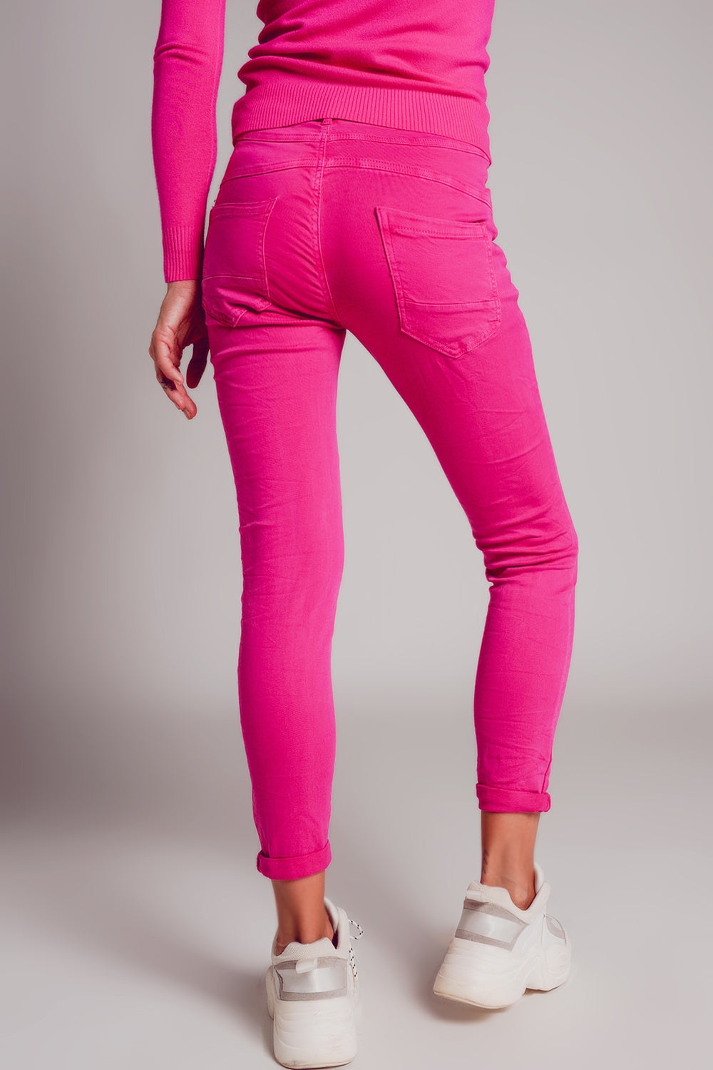 Exposed buttons skinny jeans in fuchsia Q2 Jeans BoutiqueLua