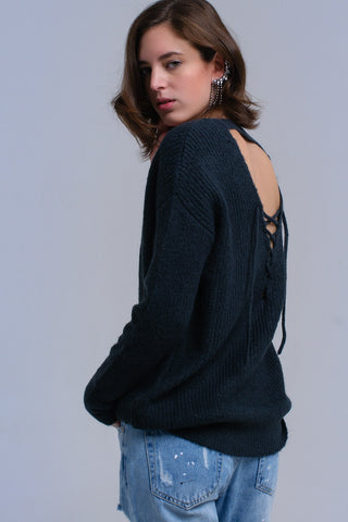 Pull en tricot vert avec fermeture à nouer dans le dos