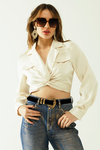 Satin V-neck cream crop top with long sleeves and frontal pockets