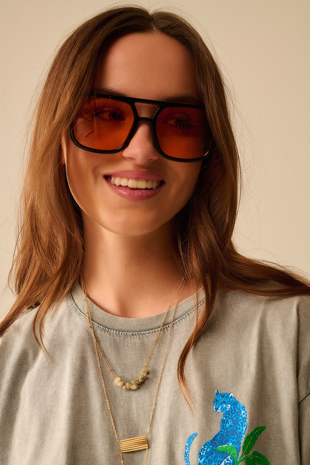 Sunglasses with black frames and orange lenses