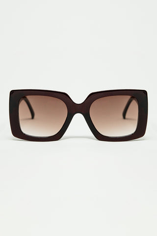 vintage silhouette sunglasses with a subtle angled cat-eye in burgundy