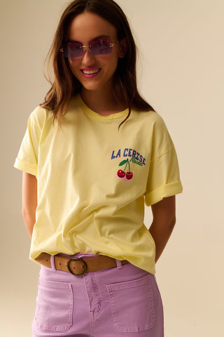 Yellow T-shirt with La Cerise Market Saint-Tropez graphic