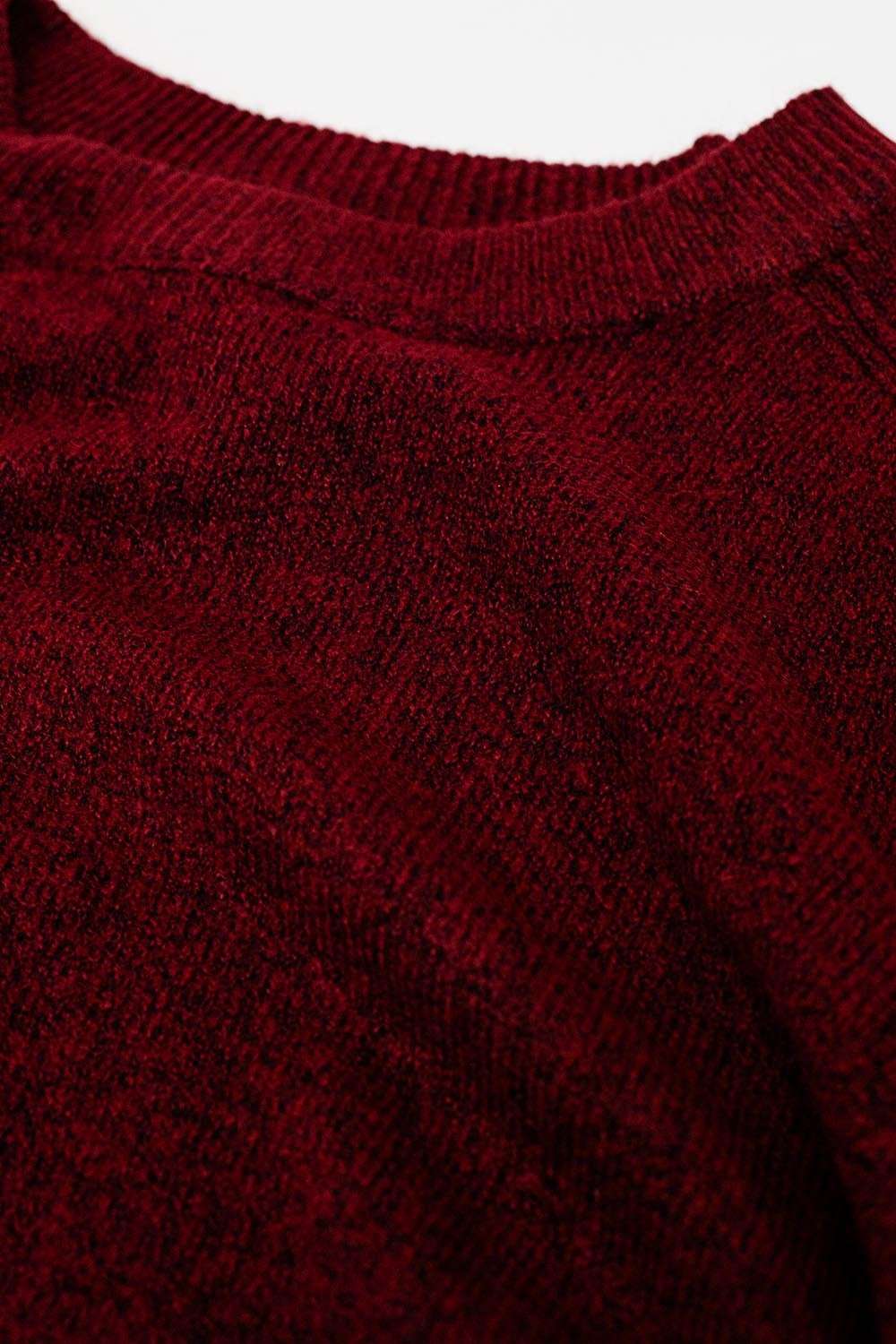 Burgundy crew neck sweater with seam detail on sleeve