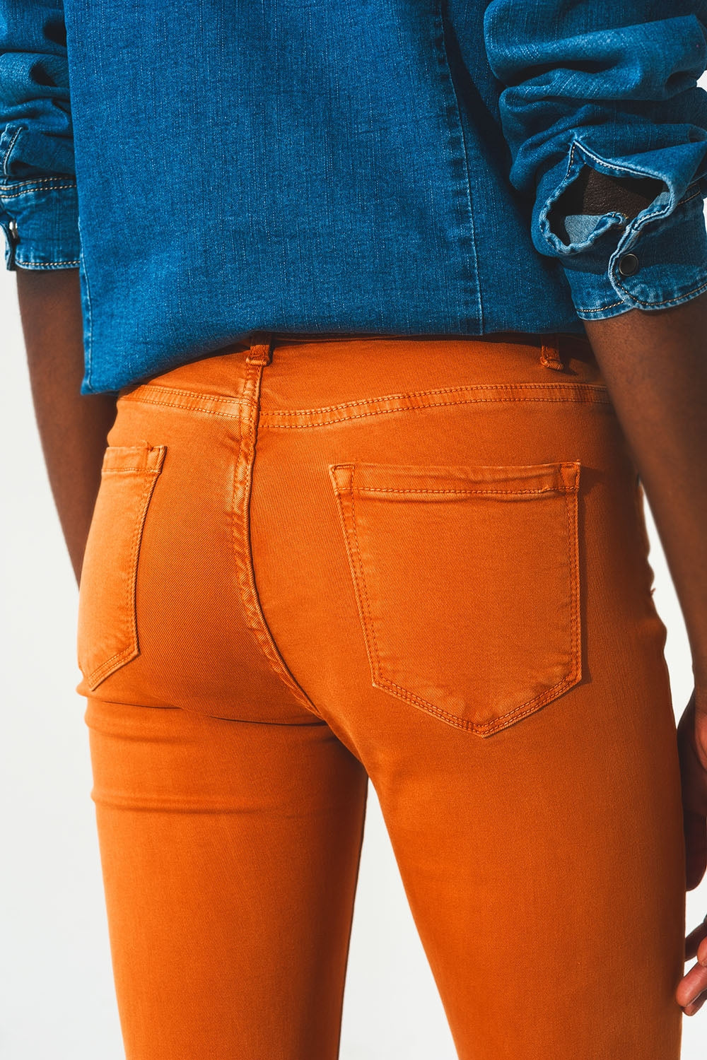 Flare jeans with raw hem edge in orange