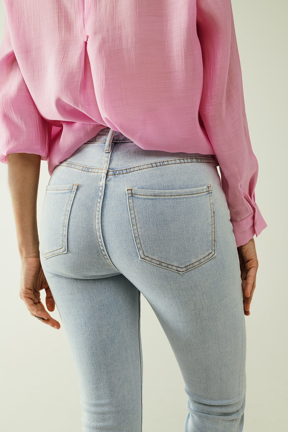 Flared light blue jeans with five pockets and seamless finish - Jeans