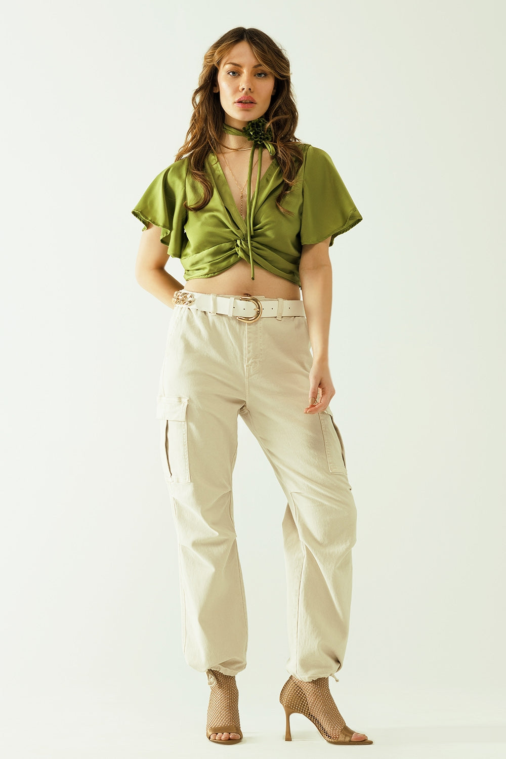 Green V-neck crop top with short sleeves and a flower detail on the neck - Tops