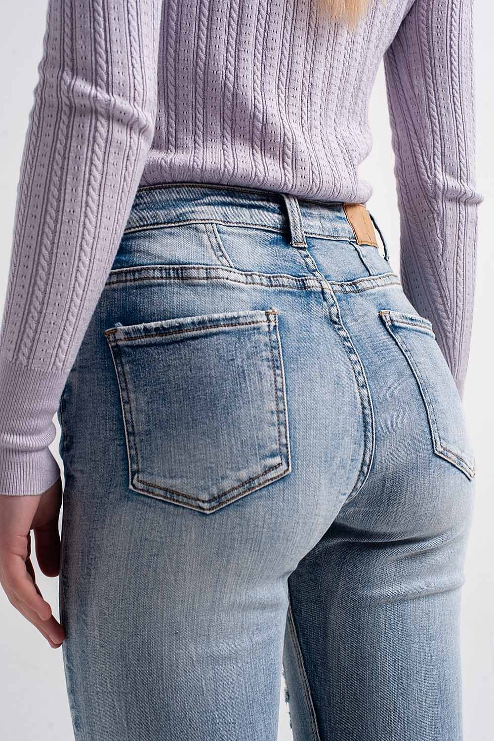 Heather skinny leg distressed jeans with button detail in light blue Q2 Jeans BoutiqueLua