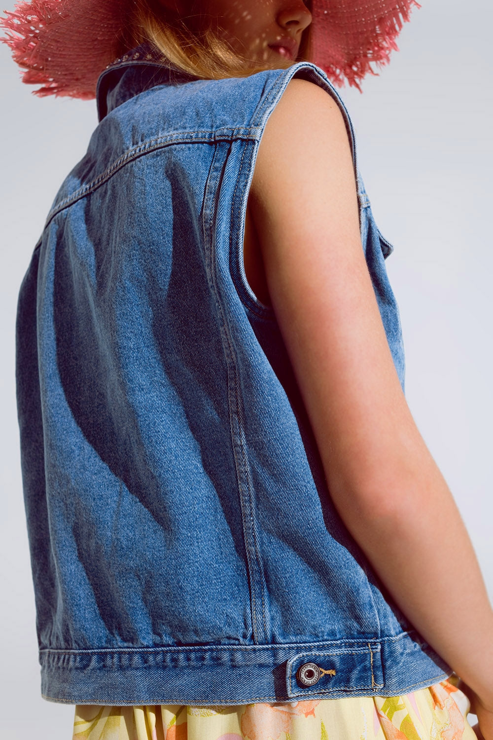 light wash denim vest with rhinestone detail on the collar Q2 Coats and Jackets BoutiqueLua