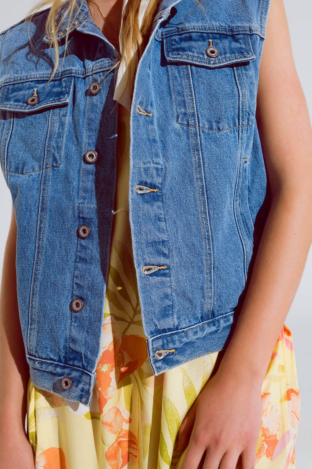 light wash denim vest with rhinestone detail on the collar Q2 Coats and Jackets BoutiqueLua