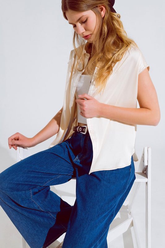 Sleeveless Blouse with pollo collar in beige - Blouses