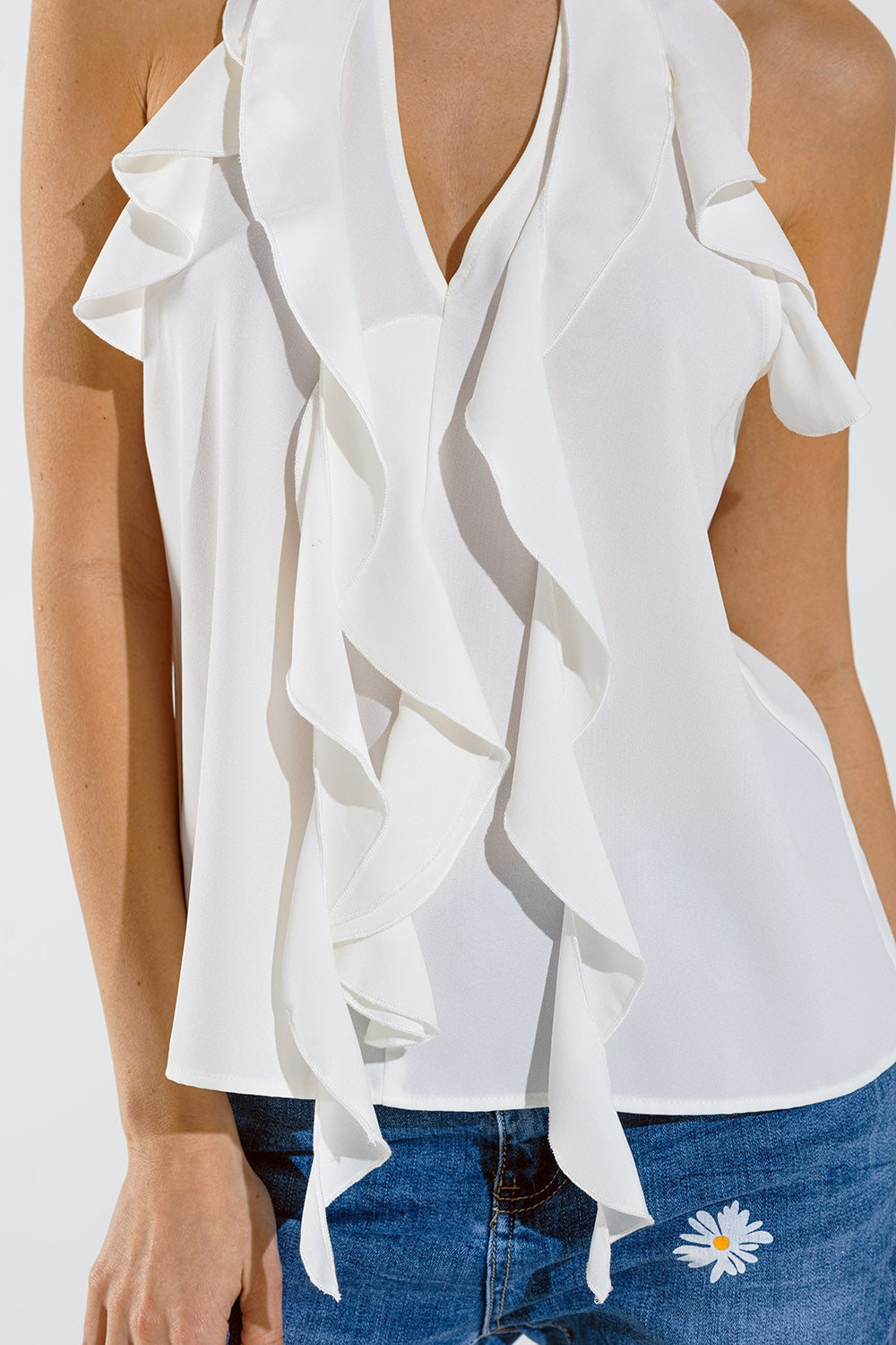 Sleeveless White Top with Ruffled Details and High Neck Q2 Tops BoutiqueLua