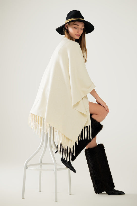 Soft knitted poncho in beige with fringes - Ponchos
