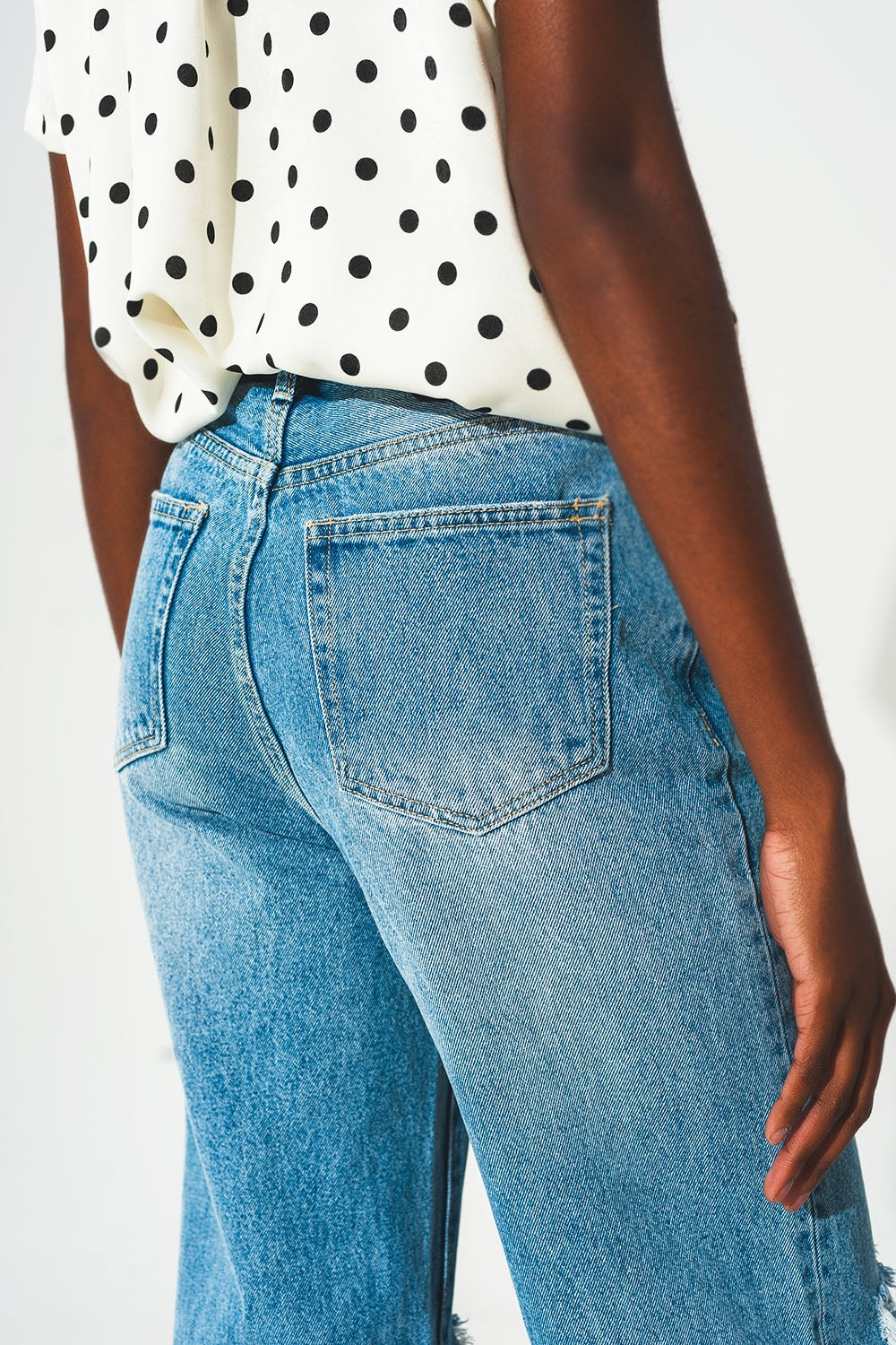 Straight jean in medium wash with rip and split hem - Jeans
