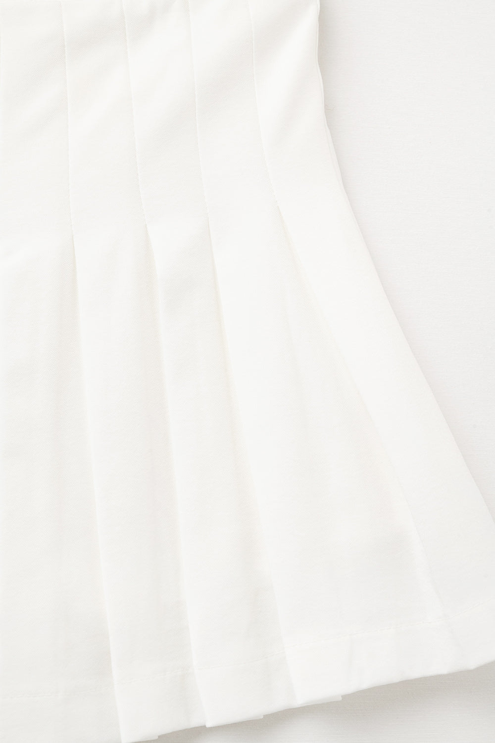 white pleated mini skirt