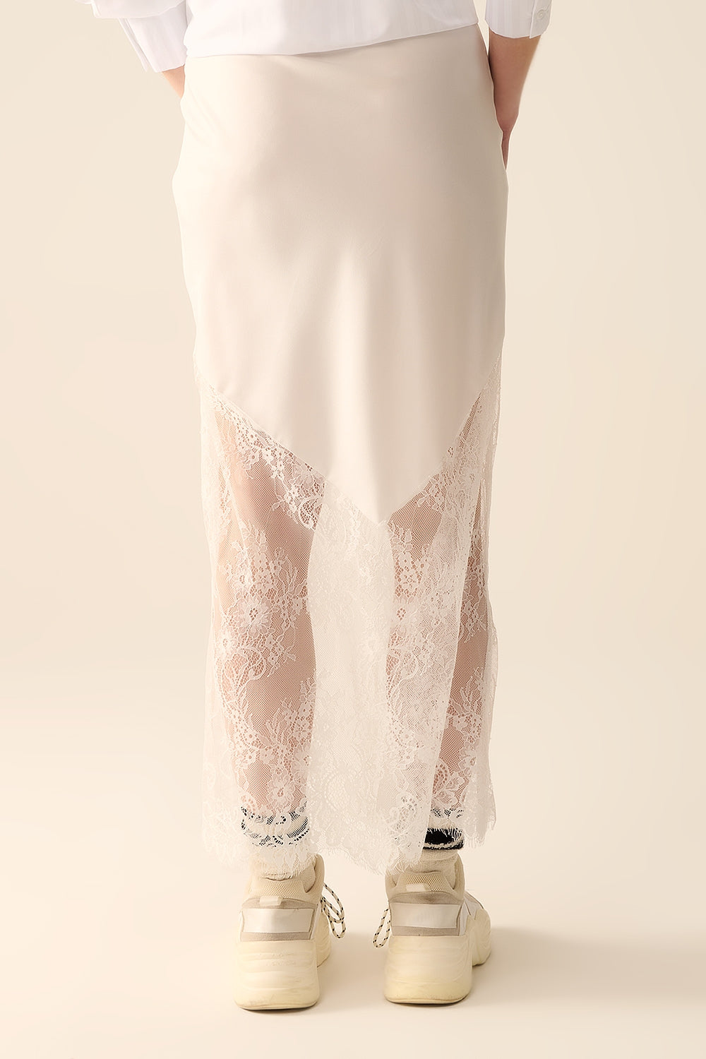 white satin skirt with lace at the bottom