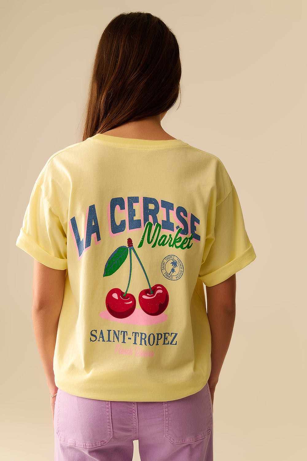 Yellow T-shirt with La Cerise Market Saint-Tropez graphic