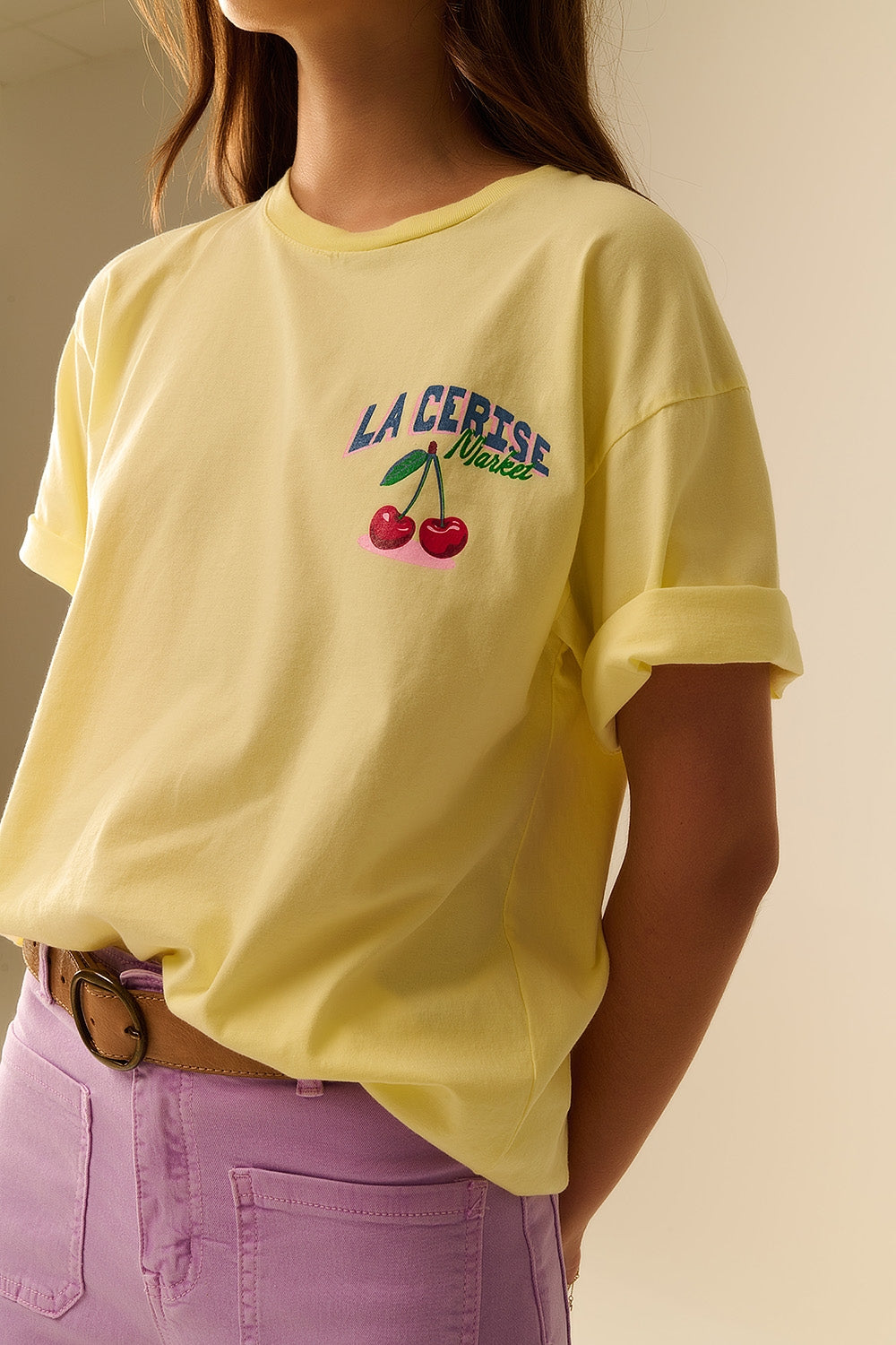 Yellow T-shirt with La Cerise Market Saint-Tropez graphic